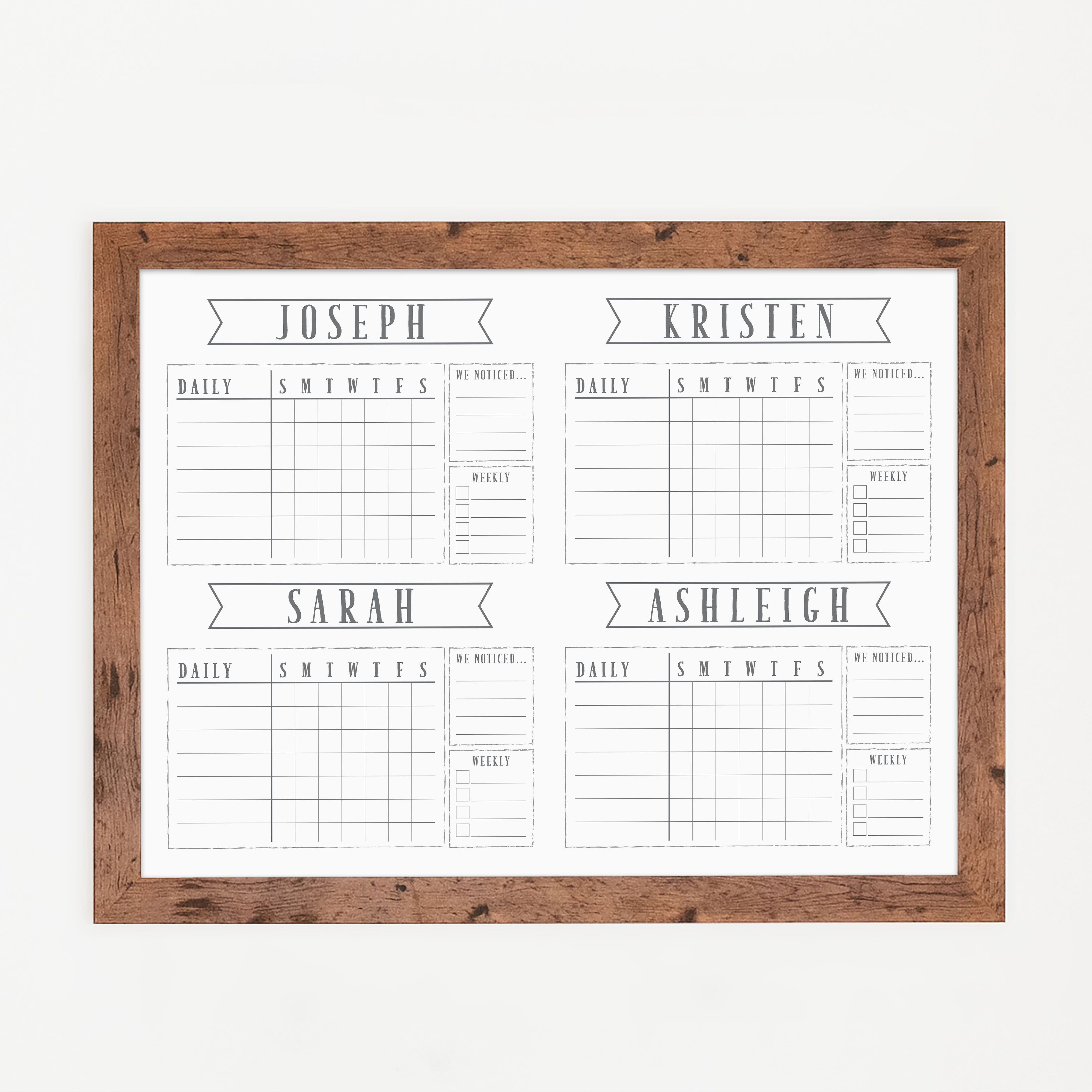 A framed whiteboard chore chart hanging on the wall