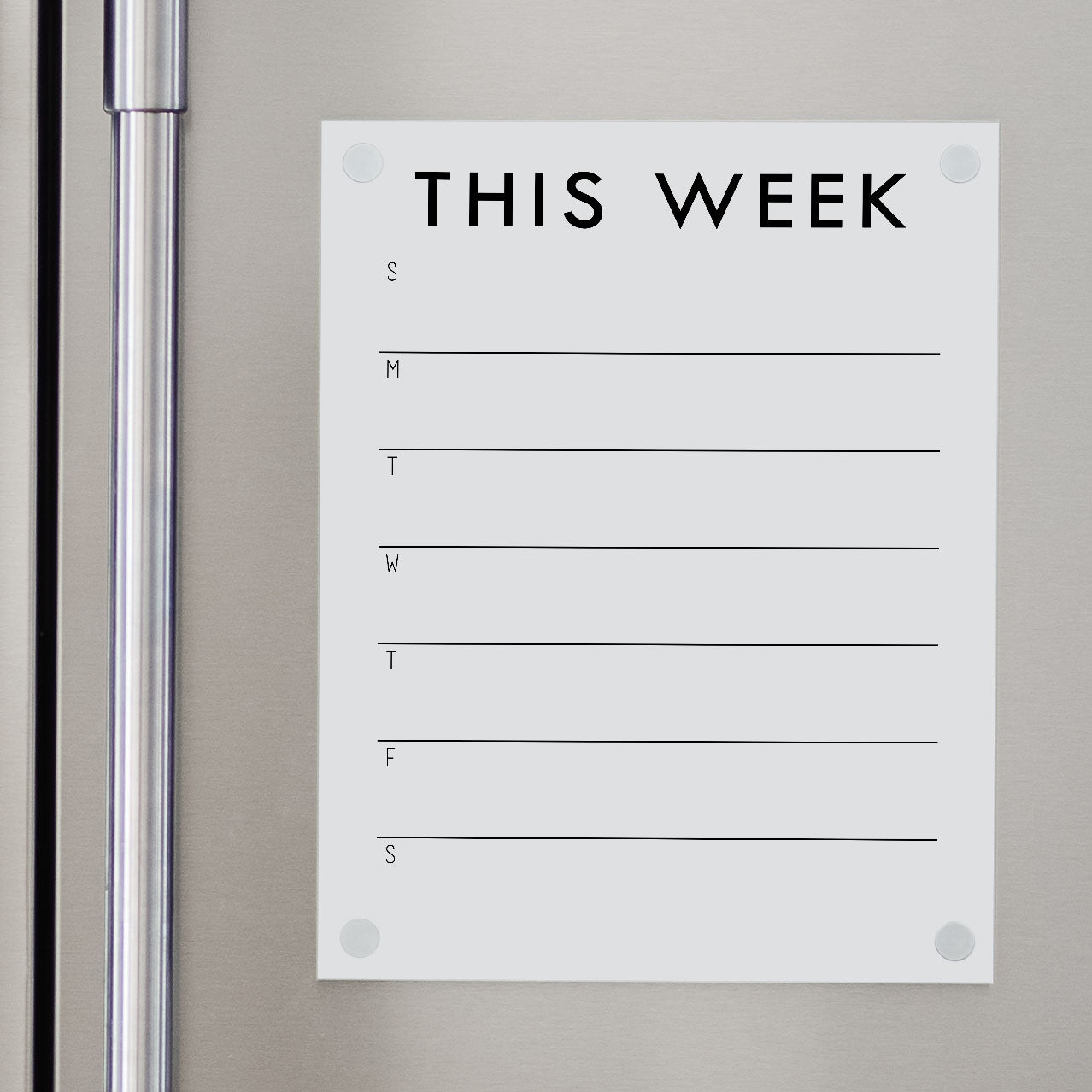 A Dry-erase weekly calender made of acrylic hanging on the fridge