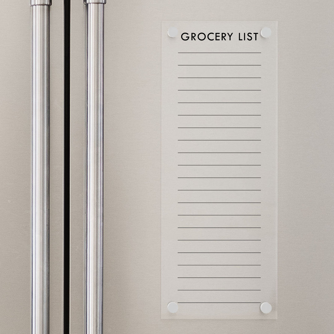 A dry-erase board made of clear acrylic with a custom title up top