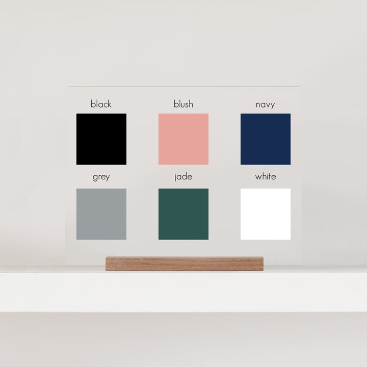 A graphic showing the six color options: black, blush, navy, grey, jade, and white.