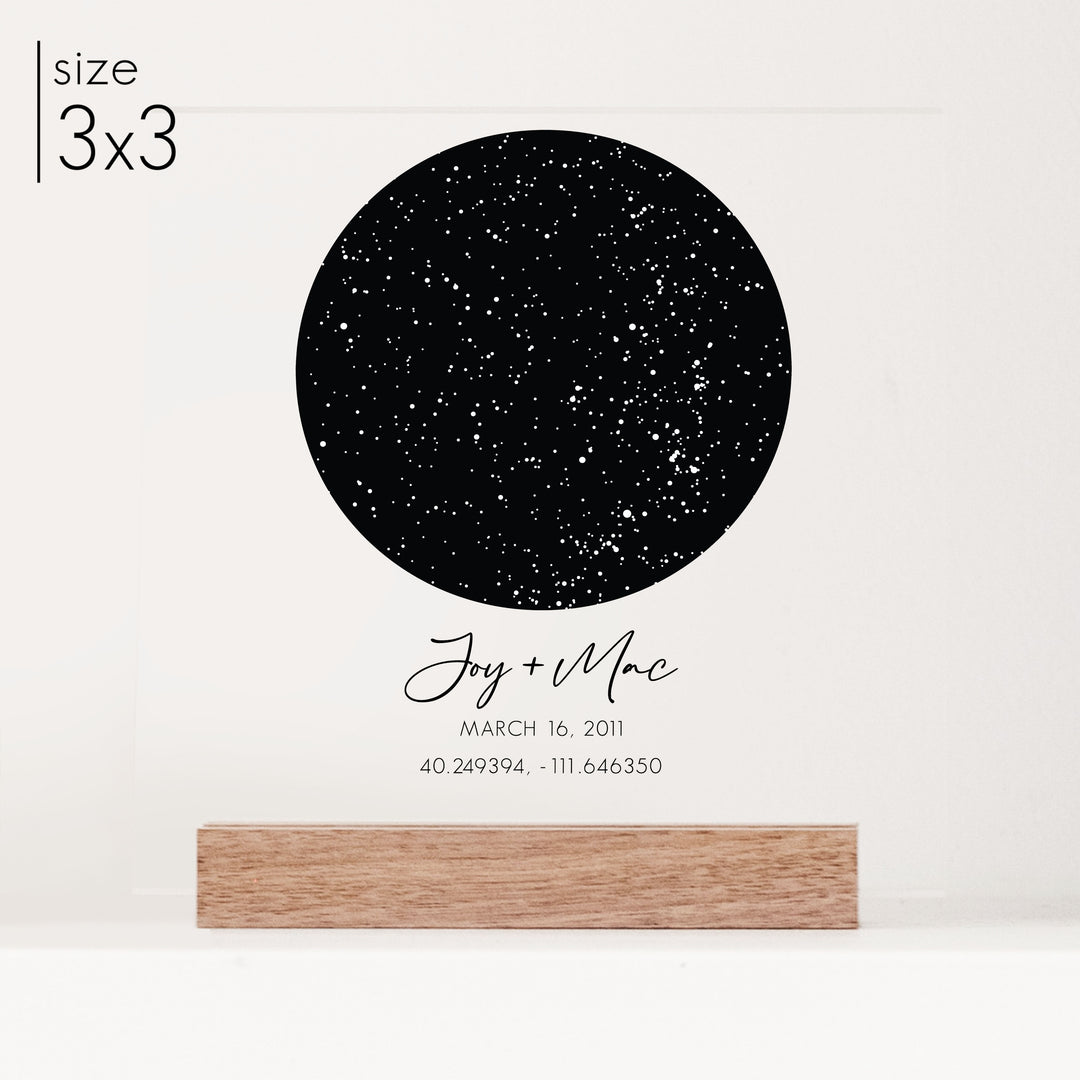 A 3x3 personalized star chart anniversary gift printed on clear acrylic with customized cursive titles.